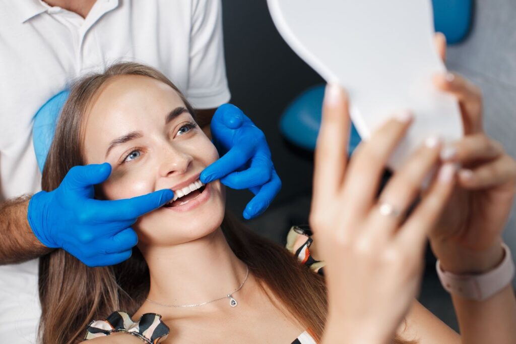 a dental profesional showing patients teeth