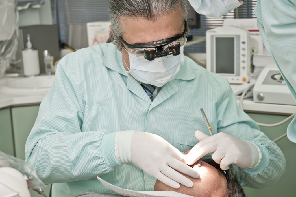 a dental professional performing a dental procedure