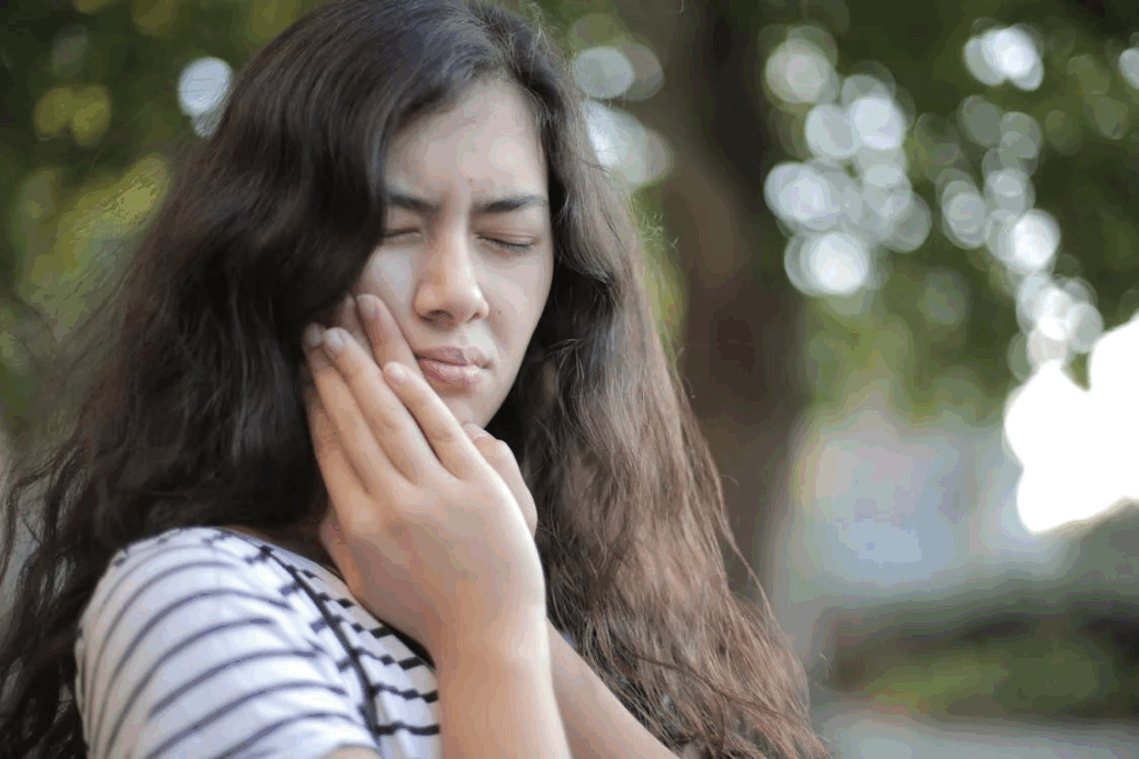 a woman experiencing tooth pain
